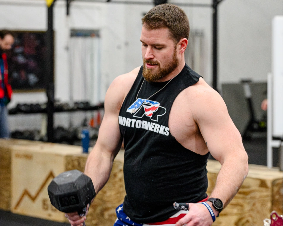 CrossFit 701 Man Training with a Dumbbell